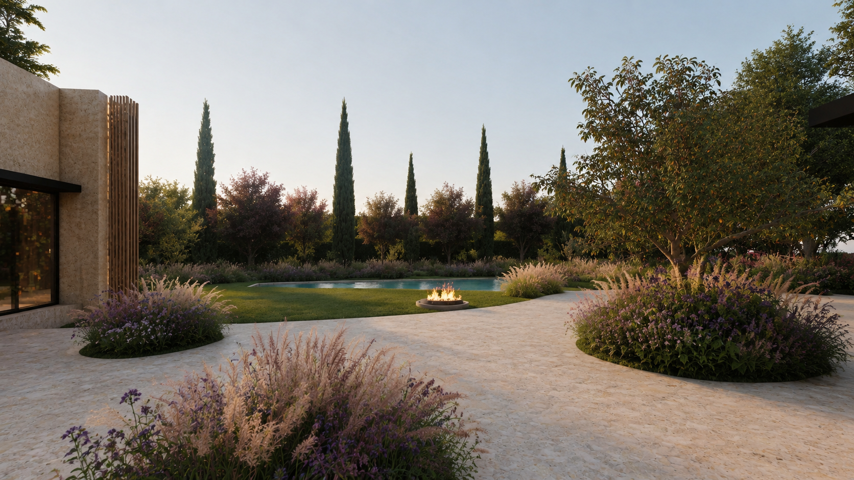 Stone-paved terrace beside a contemporary house with rounded shrubs, ornamental grasses and a row of cypresses